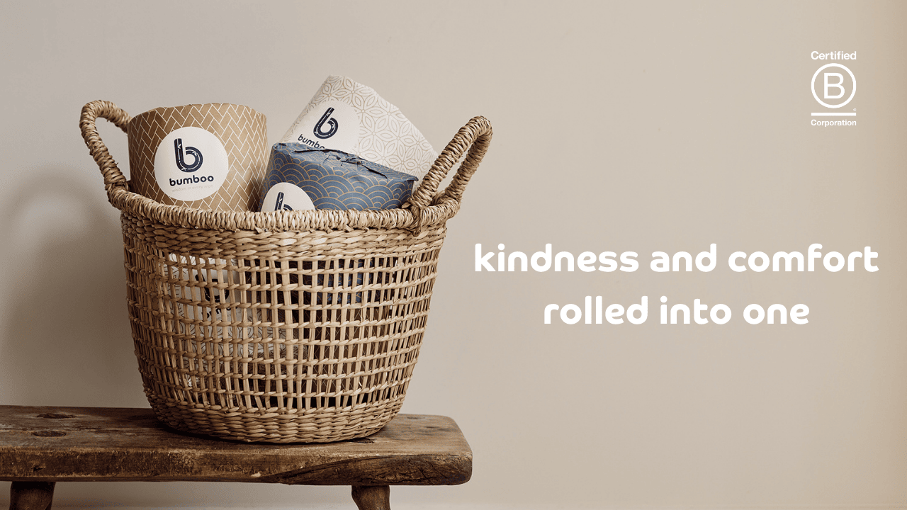 Basket of wrapped bamboo toilet rolls on a wooden bench